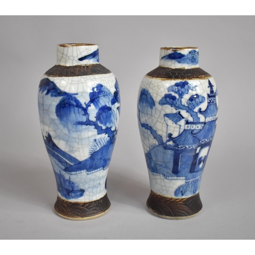 361 - A Pair of Chinese Blue and White Nanking Crackle Glazed Vases decorated with Figures, Oxidised Rims ... 