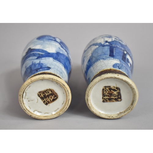 361 - A Pair of Chinese Blue and White Nanking Crackle Glazed Vases decorated with Figures, Oxidised Rims ... 