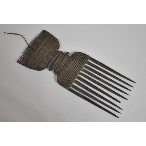 132 - A 19th Century African Tribal Comb with Roudel Design having Paper Label. 24.5cms Long