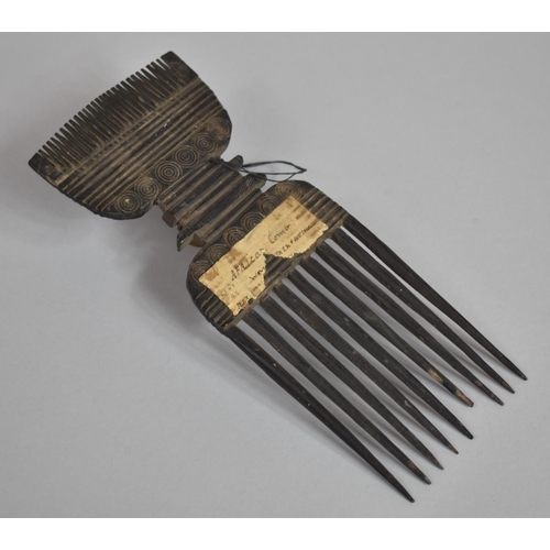 132 - A 19th Century African Tribal Comb with Roudel Design having Paper Label. 24.5cms Long