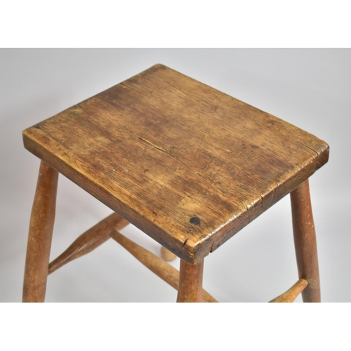 99 - A Late 19th/Early 20th Century Elm Topped Stool with Central Stretcher, 51cms High, 33x16.5cms Top