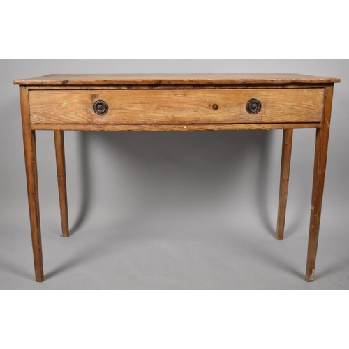 52 - A 19th Century Pitch Pine Side Table on Tapered Supports Having Central Long Drawer. 107cms Wide