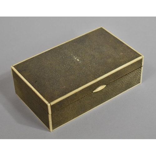 217 - An Art Deco Early 20th Century Shagreen Cigar/Cigarette Box with Ivory Edging. 17.5x10.5x5.5cms High