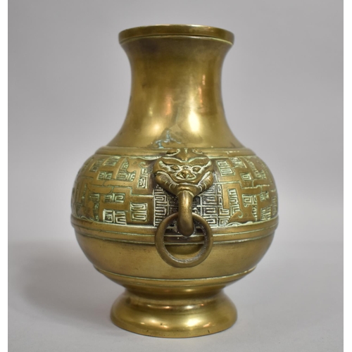 298 - A Chinese Bronze Altar Vase of Baluster Form with Lion Mask Ring Handles. 18cms High