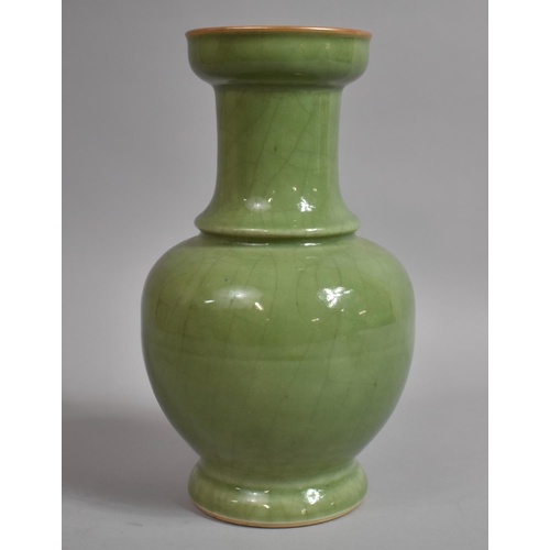 304 - A Chinese Celadon Crackle Glaze Vase, 29cms High