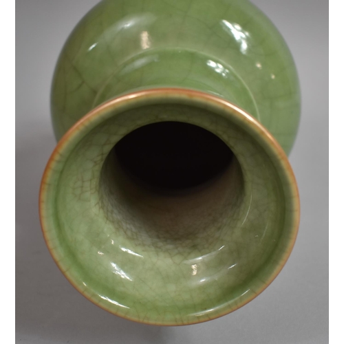 304 - A Chinese Celadon Crackle Glaze Vase, 29cms High