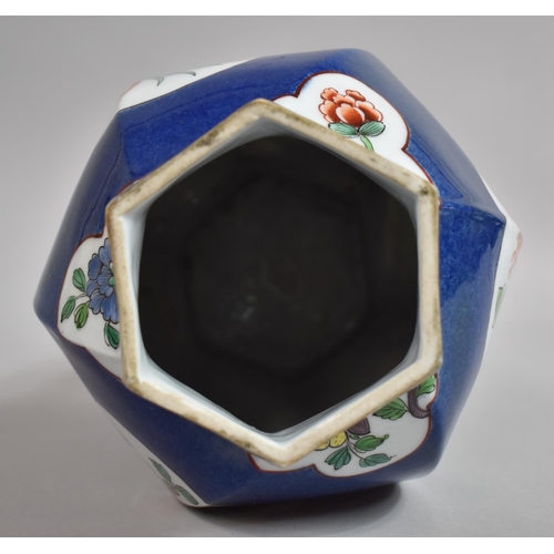 387 - A Chinese Powder Blue Octagonal Vase of Shaped Form with Floral Cartouches. 31cms High