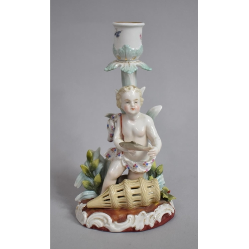 331 - A Continental Porcelain Figural Candlestick in the Form of a Cherub with Fish Trap, Under Glaze R Ma... 