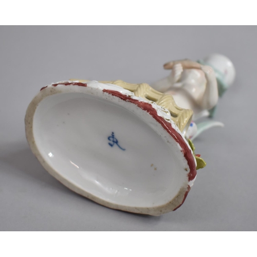 331 - A Continental Porcelain Figural Candlestick in the Form of a Cherub with Fish Trap, Under Glaze R Ma... 