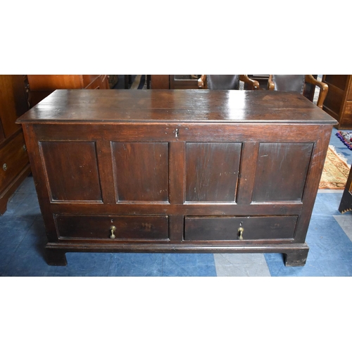 450 - An Early 19th Century Oak Mule Chest with Two base Drawers, Planked Hinged Lid and Four Panel Front.... 