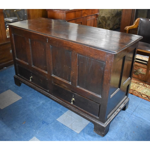 450 - An Early 19th Century Oak Mule Chest with Two base Drawers, Planked Hinged Lid and Four Panel Front.... 