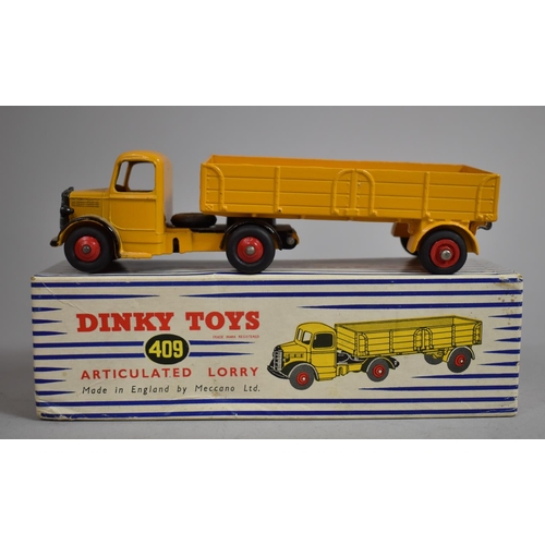 12 - A Boxed Dinky toys 409 Bedford Articulated Lorry in Yellow. (NM, E)