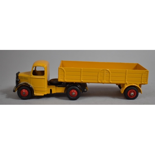 12 - A Boxed Dinky toys 409 Bedford Articulated Lorry in Yellow. (NM, E)