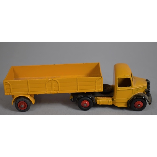 12 - A Boxed Dinky toys 409 Bedford Articulated Lorry in Yellow. (NM, E)