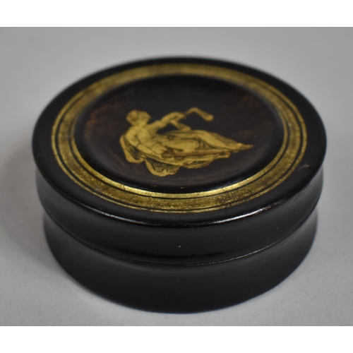 13 - A 19th Century Continental Lacquered Papier Mache Circular Snuff Box, the Lid Decorated with Reclini... 