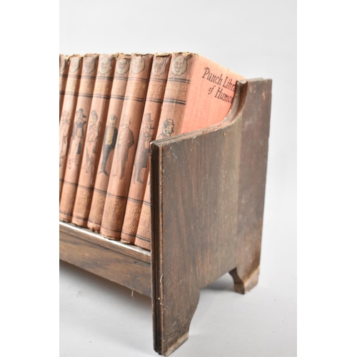 53 - An Edwardian Wooden Book Trough Containing 25 Volumes Punch Library of Humour Published by The Educa... 