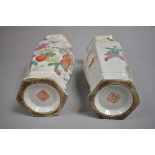 335 - A Pair of Chinese Porcelain Vases of Hexagonal Form decorated in the Famille Rose Palette with Figur... 