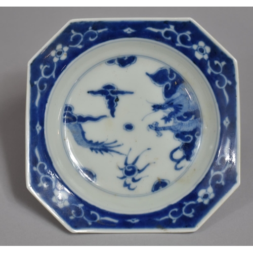 317 - A Oriental Blue and White Porcelain Shaped Dish, Dragon Chasing Flaming Pearl Design with Floral Blu... 