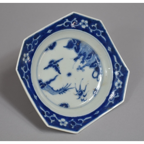 317 - A Oriental Blue and White Porcelain Shaped Dish, Dragon Chasing Flaming Pearl Design with Floral Blu... 