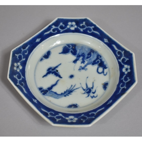 317 - A Oriental Blue and White Porcelain Shaped Dish, Dragon Chasing Flaming Pearl Design with Floral Blu... 