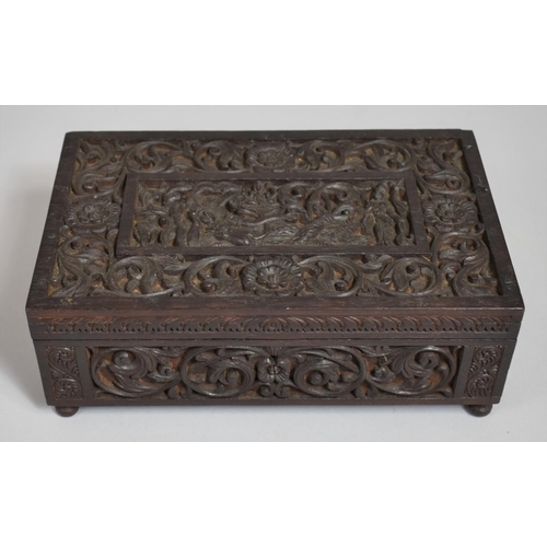 A 19th century Carved Indian Jewel Box, The Top Decorated with