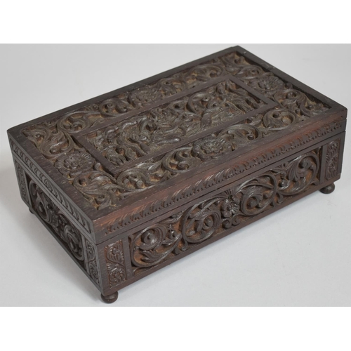 12 - A 19th century Carved Indian Jewel Box, The Top Decorated with Reclining Shiva Flanked by Hindu Gods... 