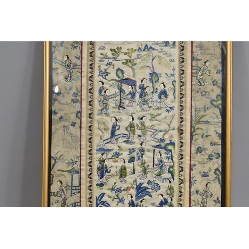 222 - A Framed Chinese Silk Embroidered Sleeve Panel Depicting Maidens in Exterior Garden Setting.