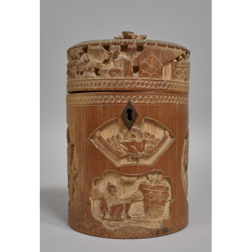 254 - A Chinese Cylindrical Bamboo Tea Caddy having Intricately Carved Decoration Depicting Elder Scholars... 