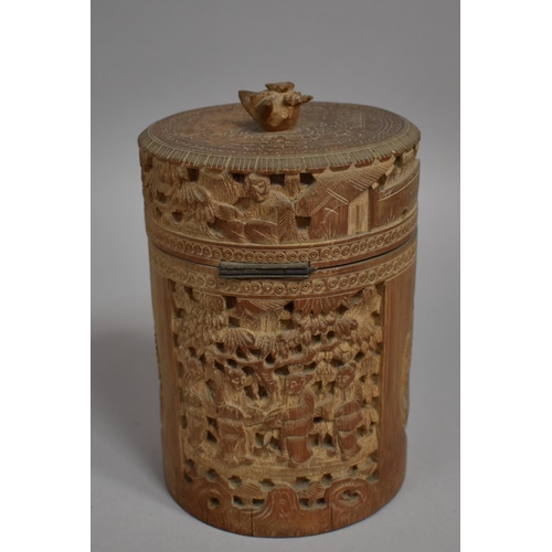 254 - A Chinese Cylindrical Bamboo Tea Caddy having Intricately Carved Decoration Depicting Elder Scholars... 