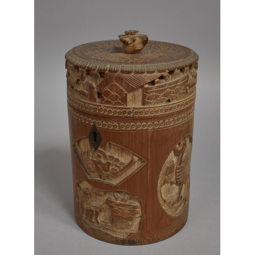 254 - A Chinese Cylindrical Bamboo Tea Caddy having Intricately Carved Decoration Depicting Elder Scholars... 