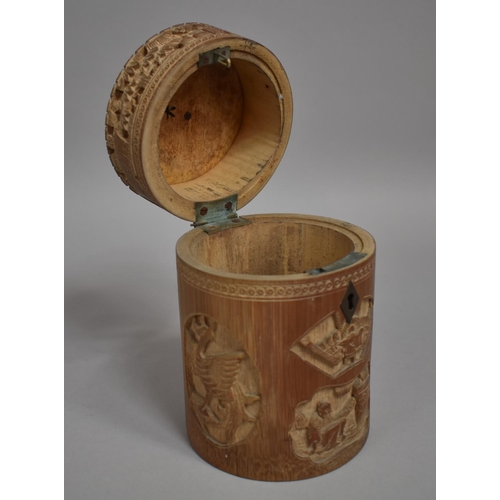 254 - A Chinese Cylindrical Bamboo Tea Caddy having Intricately Carved Decoration Depicting Elder Scholars... 