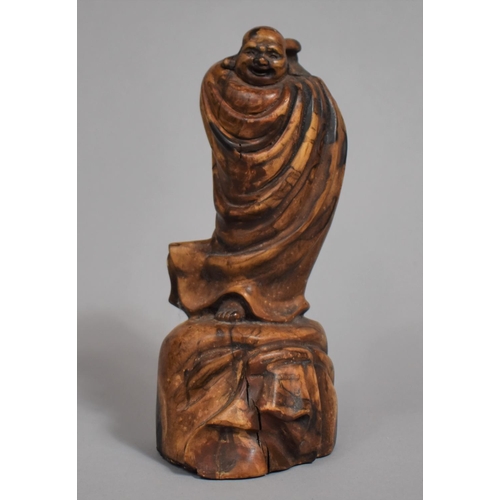 246 - An Oriental Carved Wooden Study of Robed Immortal Standing on Rock. 17.5cms High