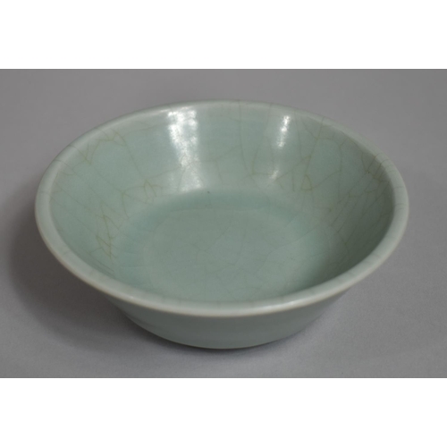 359 - A Chinese Celadon Glaze Bowl, Crackle Glazed, 13cms Diameter.