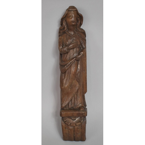 54 - An Early Carved Oak Figural Mount in the Form of a Maiden on Scrolled Acanthus Sconce. 37cms High