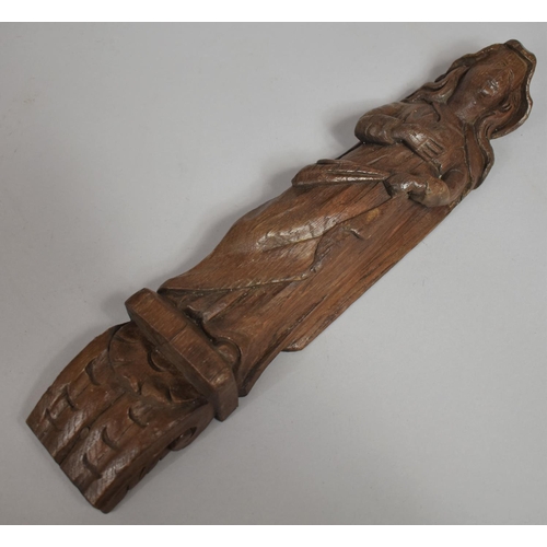 54 - An Early Carved Oak Figural Mount in the Form of a Maiden on Scrolled Acanthus Sconce. 37cms High