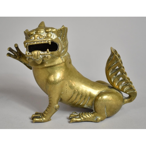 262 - A Chinese Bronze Incense Burner in the Form of a Snarling Temple Lion in Seated Position with Right ... 