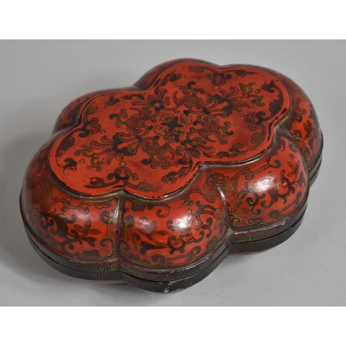 249 - A 19th Century Lacquered Box and Cover with Scalloped Edge decorated with Bats and Scrolls on Red Gr... 