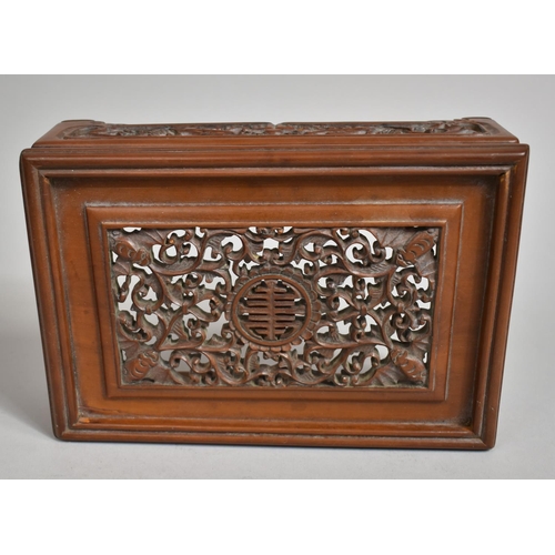 243 - A Chinese Cherry Wood Pierced and Carved Rectangular Stand decorated with Bats, Vines and Dragons an... 