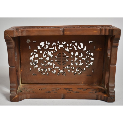 243 - A Chinese Cherry Wood Pierced and Carved Rectangular Stand decorated with Bats, Vines and Dragons an... 