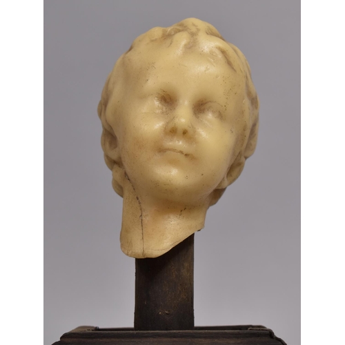 30 - An Antique Wax Bust of a Young Boy, Mounted on a Wooden Plinth, 25cms High