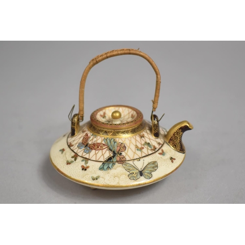 450 - A Japanese Satsuma Miniature Teapot of Compressed Circular Form and Decorated with Butterflies, Wire... 