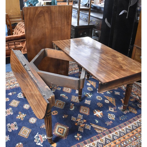 465 - A 19th Century Mahogany Drop Leaf Extending Dining Table on Turned Supports, One Extra Leaf, Concert... 