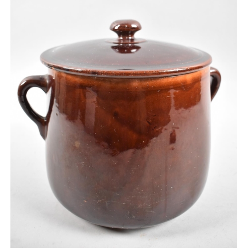 44 - A Treacle Glazed Two Handled Stew Pot with Lid, 24cm high