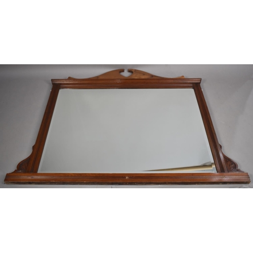 544 - A Late Victorian Walnut Overmantle Mirror, 147cm wide and 116cm high