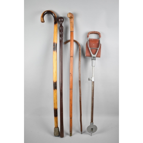 143 - A Collection of Four Walking Sticks and a Shooting Stick