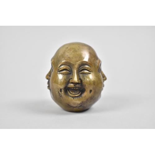 15 - A Reproduction Far Eastern Bronze Four Mask Buddhistic Head, 5.5cm high