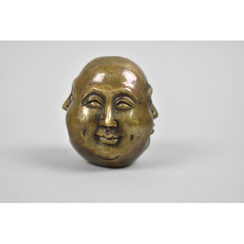 15 - A Reproduction Far Eastern Bronze Four Mask Buddhistic Head, 5.5cm high