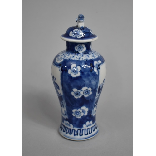 289 - A Small 19th Century Blue and White Baluster Vase and Cover decorated with Figural Cartouches with M... 