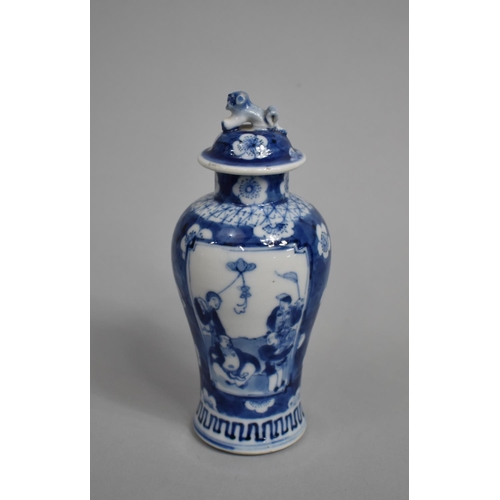 289 - A Small 19th Century Blue and White Baluster Vase and Cover decorated with Figural Cartouches with M... 