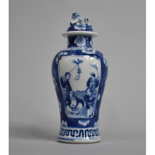 289 - A Small 19th Century Blue and White Baluster Vase and Cover decorated with Figural Cartouches with M... 